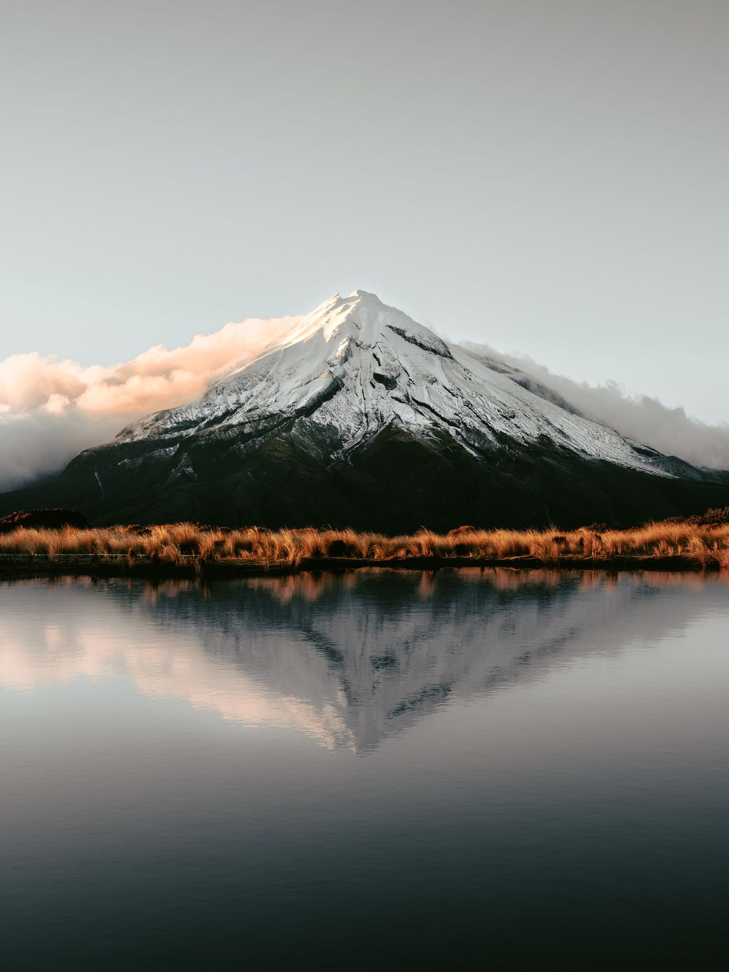 Mount Taranaki reflected in a lake, New Zealand